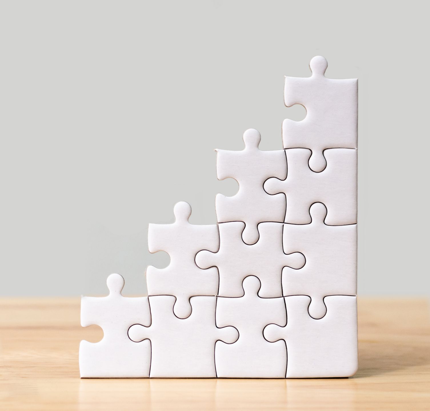 Puzzle pieces slotting together 